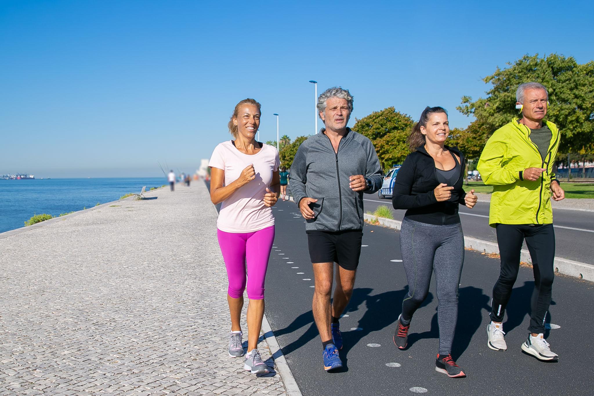 Active adults running outdoors together